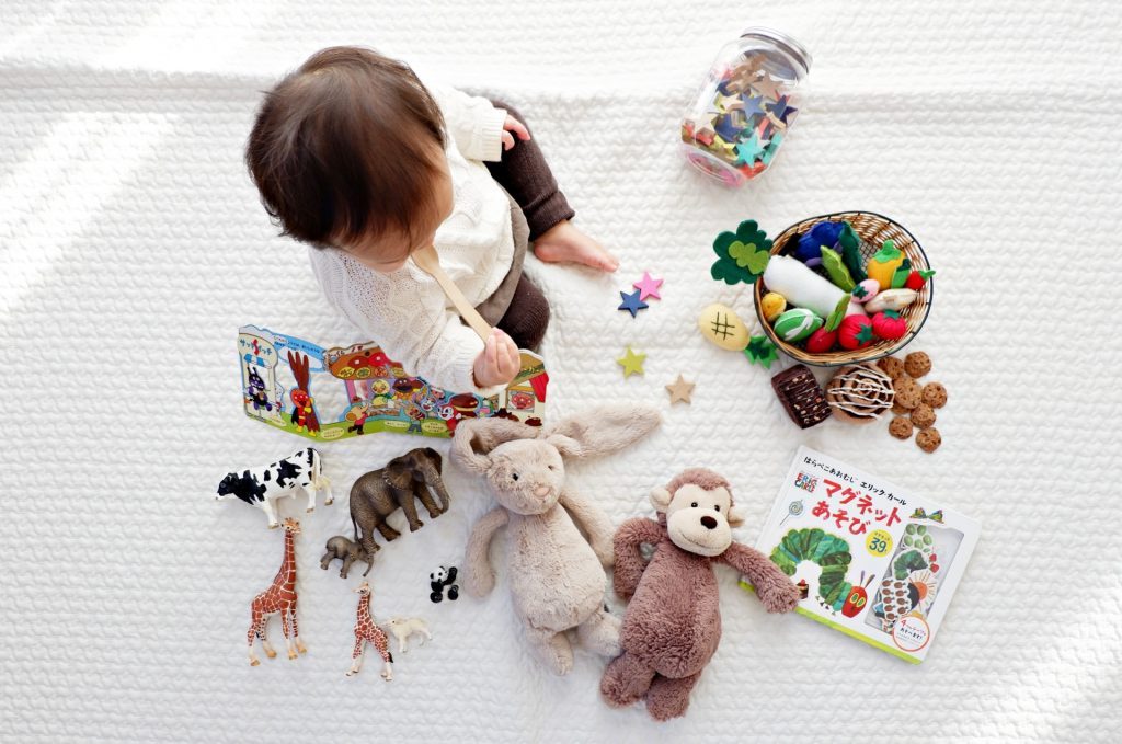 Baby playing with animal toys