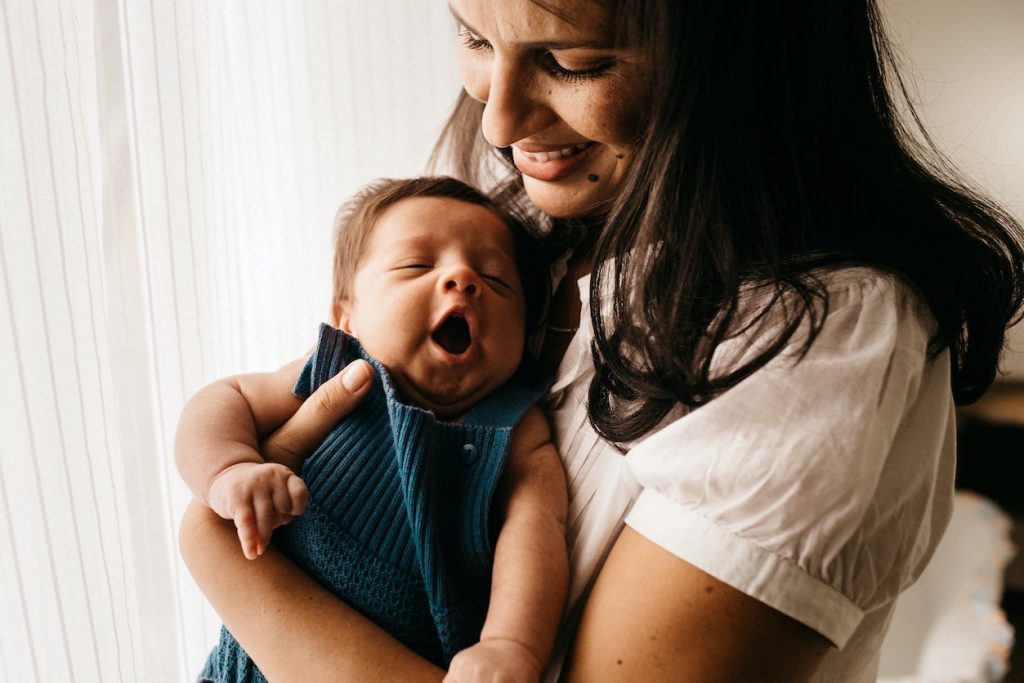 mother smiling with baby