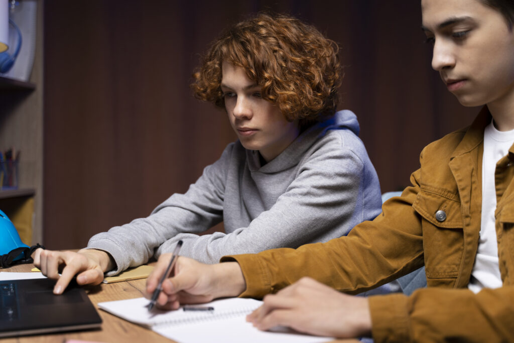 Two A-Level students doing their homework - Photo by Free Photo
